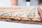 Vintage Turkish rug in living room setting, old rug, antique rug, pastel colors, faded colors, Turkish rug, vintage rug, soft rug, Portland, Oregon, rug store, rug shop, local shop