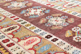 Vintage Turkish rug in living room setting, old rug, antique rug, pastel colors, faded colors, Turkish rug, vintage rug, soft rug, Portland, Oregon, rug store, rug shop, local shop