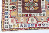 Vintage Turkish rug in living room setting, old rug, antique rug, pastel colors, faded colors, Turkish rug, vintage rug, soft rug, Portland, Oregon, rug store, rug shop, local shop