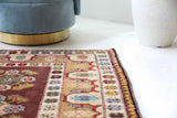 Vintage Turkish rug in living room setting, old rug, antique rug, pastel colors, faded colors, Turkish rug, vintage rug, soft rug, Portland, Oregon, rug store, rug shop, local shop