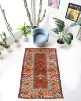 Vintage Turkish rug in a living room setting, pile rug, Turkish rug, vintage rug, portland, rug shop, bright colors, wild shaman, soft rug, bold color, Portland, Oregon, rug store, rug shop, local shop, antique rug