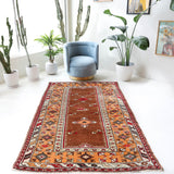 Vintage Turkish rug in a living room setting, pile rug, Turkish rug, vintage rug, portland, rug shop, bright colors, wild shaman, soft rug, bold color, Portland, Oregon, rug store, rug shop, local shop, antique rug