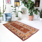 Vintage Turkish rug in a living room setting, pile rug, Turkish rug, vintage rug, portland, rug shop, bright colors, wild shaman, soft rug, bold color, Portland, Oregon, rug store, rug shop, local shop, antique rug