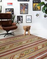 Vintage kilim rug in living room setting, old rug, antique rug, pastel colors, faded colors, Turkish rug, vintage rug, soft rug, Portland, Oregon, rug store, rug shop, local shop, earthy tones, earthy colors, warm colors