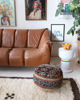 Floor pouf in a living room setting, pillow, turkish pillow, kilim pillow, home decor, decorative pillow, sham, rug pillow, decor, home decor, pouf, floor cushion, cushion, Portland, rugshop, Oregon, Wild Shaman, ottoman