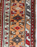 Vintage Turkish rug in a living room setting, pile rug, Turkish rug, vintage rug, portland, rug shop, bright colors, wild shaman, soft rug, bold color, Portland, Oregon, rug store, rug shop, local shop, antique rug