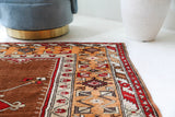 Vintage Turkish rug in a living room setting, pile rug, Turkish rug, vintage rug, portland, rug shop, bright colors, wild shaman, soft rug, bold color, Portland, Oregon, rug store, rug shop, local shop, antique rug
