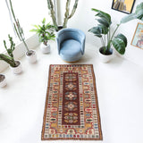 Vintage Turkish rug in living room setting, old rug, antique rug, pastel colors, faded colors, Turkish rug, vintage rug, soft rug, Portland, Oregon, rug store, rug shop, local shop
