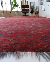 Antique Turkmen rug in a living room setting, pile rug, Turkish rug, vintage rug, portland, rug shop, bright colors, wild shaman, soft rug, bold color, Portland, Oregon, rug store, rug shop, local shop, antique rug