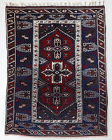 Vintage Turkish rug in a living room setting, pile rug, Turkish rug, vintage rug, portland, rug shop, bright colors, wild shaman, soft rug, bold color, Portland, Oregon, rug store, rug shop, local shop, antique rug