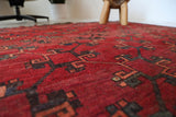 Antique Turkmen rug in a living room setting, pile rug, Turkish rug, vintage rug, portland, rug shop, bright colors, wild shaman, soft rug, bold color, Portland, Oregon, rug store, rug shop, local shop, antique rug