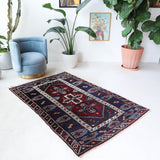 Vintage Turkish rug in a living room setting, pile rug, Turkish rug, vintage rug, portland, rug shop, bright colors, wild shaman, soft rug, bold color, Portland, Oregon, rug store, rug shop, local shop, antique rug