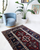 Vintage Turkish rug in a living room setting, pile rug, Turkish rug, vintage rug, portland, rug shop, bright colors, wild shaman, soft rug, bold color, Portland, Oregon, rug store, rug shop, local shop, antique rug