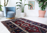 Vintage Turkish rug in a living room setting, pile rug, Turkish rug, vintage rug, portland, rug shop, bright colors, wild shaman, soft rug, bold color, Portland, Oregon, rug store, rug shop, local shop, antique rug