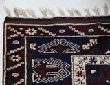 Vintage Turkish rug in a living room setting, pile rug, Turkish rug, vintage rug, portland, rug shop, bright colors, wild shaman, soft rug, bold color, Portland, Oregon, rug store, rug shop, local shop, antique rug
