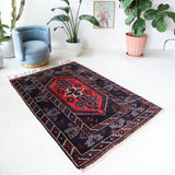 Vintage Turkish rug in a living room setting, pile rug, Turkish rug, vintage rug, portland, rug shop, bright colors, wild shaman, soft rug, bold color, Portland, Oregon, rug store, rug shop, local shop, antique rug