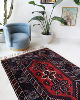 Vintage Turkish rug in a living room setting, pile rug, Turkish rug, vintage rug, portland, rug shop, bright colors, wild shaman, soft rug, bold color, Portland, Oregon, rug store, rug shop, local shop, antique rug