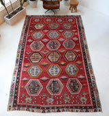 Vintage kilim rug in room decor setting, old rug, antique rug, pastel colors, faded colors, Turkish rug, vintage rug, soft rug, Portland, Oregon, rug store, rug shop, local shop, bold colors, bright colors, faded colors