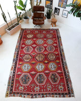 Vintage kilim rug in room decor setting, old rug, antique rug, pastel colors, faded colors, Turkish rug, vintage rug, soft rug, Portland, Oregon, rug store, rug shop, local shop, bold colors, bright colors, faded colors