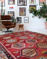 Vintage kilim rug in room decor setting, old rug, antique rug, pastel colors, faded colors, Turkish rug, vintage rug, soft rug, Portland, Oregon, rug store, rug shop, local shop, bold colors, bright colors, faded colors