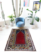 Vintage Turkish rug in a living room setting, pile rug, Turkish rug, vintage rug, portland, rug shop, bright colors, wild shaman, soft rug, bold color, Portland, Oregon, rug store, rug shop, local shop, antique rug