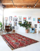 Vintage kilim rug in room decor setting, old rug, antique rug, pastel colors, faded colors, Turkish rug, vintage rug, soft rug, Portland, Oregon, rug store, rug shop, local shop, bold colors, bright colors, faded colors