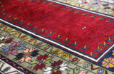 Vintage Turkish rug in a living room setting, pile rug, Turkish rug, vintage rug, portland, rug shop, bright colors, wild shaman, soft rug, bold color, Portland, Oregon, rug store, rug shop, local shop, antique rug