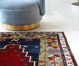 Vintage Turkish rug in a living room setting, pile rug, Turkish rug, vintage rug, portland, rug shop, bright colors, wild shaman, soft rug, bold color, Portland, Oregon, rug store, rug shop, local shop, antique rug