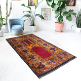 Vintage Turkish rug in a living room setting, pile rug, Turkish rug, vintage rug, portland, rug shop, bright colors, wild shaman, soft rug, bold color, Portland, Oregon, rug store, rug shop, local shop, antique rug