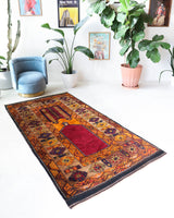 Vintage Turkish rug in a living room setting, pile rug, Turkish rug, vintage rug, portland, rug shop, bright colors, wild shaman, soft rug, bold color, Portland, Oregon, rug store, rug shop, local shop, antique rug