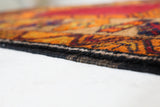 Vintage Turkish rug in a living room setting, pile rug, Turkish rug, vintage rug, portland, rug shop, bright colors, wild shaman, soft rug, bold color, Portland, Oregon, rug store, rug shop, local shop, antique rug