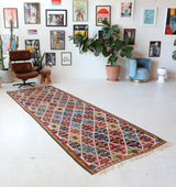 Vintage Turkish runner rug in a living room setting, pile rug, Turkish rug, vintage rug, portland, rug shop, bright colors, wild shaman, soft rug, bold color, Portland, Oregon, rug store, rug shop, local shop, antique rug