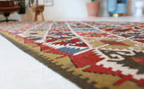 Vintage Turkish runner rug in a living room setting, pile rug, Turkish rug, vintage rug, portland, rug shop, bright colors, wild shaman, soft rug, bold color, Portland, Oregon, rug store, rug shop, local shop, antique rug