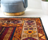 Vintage Turkish rug in a living room setting, pile rug, Turkish rug, vintage rug, portland, rug shop, bright colors, wild shaman, soft rug, bold color, Portland, Oregon, rug store, rug shop, local shop, antique rug