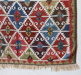 Vintage Turkish runner rug in a living room setting, pile rug, Turkish rug, vintage rug, portland, rug shop, bright colors, wild shaman, soft rug, bold color, Portland, Oregon, rug store, rug shop, local shop, antique rug