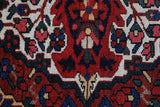 Antique Persian area rug in a living room setting, pile rug, vintage rug, portland, rug shop, bright colors, wild shaman, soft rug, bold color, Portland, Oregon, rug store, rug shop, local shop, antique rug, Persian rug, handmade rug, wool rug, distressed rug