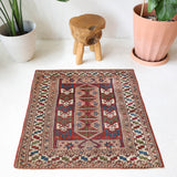 Vintage Turkish mini rug in room decor setting, old rug, antique rug, pastel colors, faded colors, Turkish rug, vintage rug, soft rug, Portland, Oregon, rug store, rug shop, local shop,  bright colors, bold colors