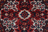 Antique Persian area rug in a living room setting, pile rug, vintage rug, portland, rug shop, bright colors, wild shaman, soft rug, bold color, Portland, Oregon, rug store, rug shop, local shop, antique rug, Persian rug, handmade rug, wool rug, distressed rug