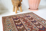 Vintage Turkish mini rug in room decor setting, old rug, antique rug, pastel colors, faded colors, Turkish rug, vintage rug, soft rug, Portland, Oregon, rug store, rug shop, local shop,  bright colors, bold colors