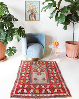 Small Turkish rug in a living room setting, pile rug, Turkish rug, vintage rug, portland, rug shop, bright colors, wild shaman, area rug, red rug, mini rug, bold color, Portland, Oregon, rug store, rug shop, local shop, flat weave, kilim rug