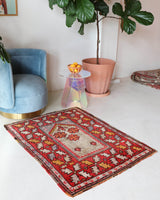 Small Turkish rug in a living room setting, pile rug, Turkish rug, vintage rug, portland, rug shop, bright colors, wild shaman, area rug, red rug, mini rug, bold color, Portland, Oregon, rug store, rug shop, local shop, flat weave, kilim rug