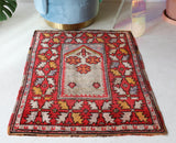 Small Turkish rug in a living room setting, pile rug, Turkish rug, vintage rug, portland, rug shop, bright colors, wild shaman, area rug, red rug, mini rug, bold color, Portland, Oregon, rug store, rug shop, local shop, flat weave, kilim rug