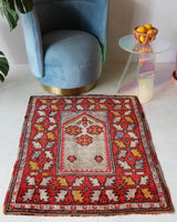 Small Turkish rug in a living room setting, pile rug, Turkish rug, vintage rug, portland, rug shop, bright colors, wild shaman, area rug, red rug, mini rug, bold color, Portland, Oregon, rug store, rug shop, local shop, flat weave, kilim rug