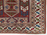 Vintage Turkish mini rug in room decor setting, old rug, antique rug, pastel colors, faded colors, Turkish rug, vintage rug, soft rug, Portland, Oregon, rug store, rug shop, local shop,  bright colors, bold colors
