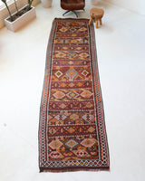 Vintage Turkish runner rug in a living room setting, pile rug, Turkish rug, vintage rug, portland, rug shop, bright colors, wild shaman, soft rug, bold color, Portland, Oregon, rug store, rug shop, local shop, antique rug