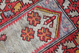 Small Turkish rug in a living room setting, pile rug, Turkish rug, vintage rug, portland, rug shop, bright colors, wild shaman, area rug, red rug, mini rug, bold color, Portland, Oregon, rug store, rug shop, local shop, flat weave, kilim rug
