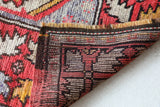 Small Turkish rug in a living room setting, pile rug, Turkish rug, vintage rug, portland, rug shop, bright colors, wild shaman, area rug, red rug, mini rug, bold color, Portland, Oregon, rug store, rug shop, local shop, flat weave, kilim rug