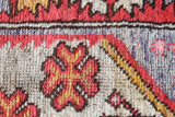 Small Turkish rug in a living room setting, pile rug, Turkish rug, vintage rug, portland, rug shop, bright colors, wild shaman, area rug, red rug, mini rug, bold color, Portland, Oregon, rug store, rug shop, local shop, flat weave, kilim rug