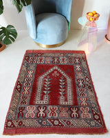 Small Turkish rug in a living room setting, pile rug, Turkish rug, vintage rug, portland, rug shop, bright colors, wild shaman, area rug, red rug, mini rug, bold color, Portland, Oregon, rug store, rug shop, local shop, flat weave, kilim rug