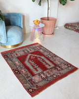 Small Turkish rug in a living room setting, pile rug, Turkish rug, vintage rug, portland, rug shop, bright colors, wild shaman, area rug, red rug, mini rug, bold color, Portland, Oregon, rug store, rug shop, local shop, flat weave, kilim rug